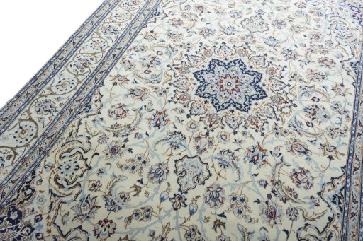 Backside of handmade New Nain rug showing knot structure and weave density