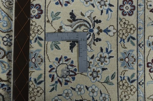 Backside of handmade New Nain rug showing knot structure and weave density