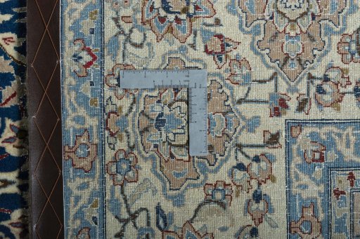 Backside of handmade 1970s Nain rug showing knot structure and weave density