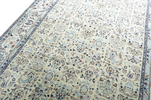 Backside of handmade New Nain rug showing knot structure and weave density
