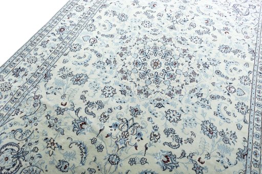 Backside of handmade New Nain rug showing knot structure and weave density