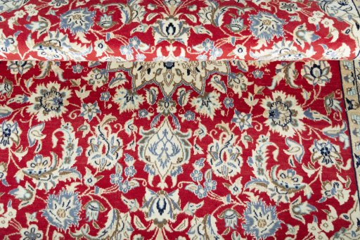 Corner detail of New Nain rug showing border pattern and Wool pile