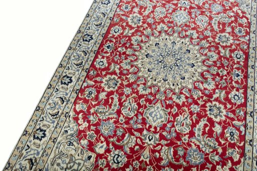 Backside of handmade New Nain rug showing knot structure and weave density