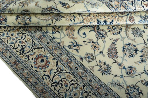 Corner detail of New Nain rug showing border pattern and Wool pile