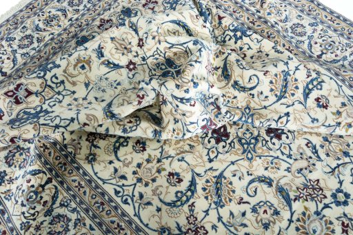 Corner detail of New Nain rug showing border pattern and Wool pile