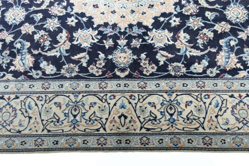 Corner detail of New Nain rug showing border pattern and Wool pile