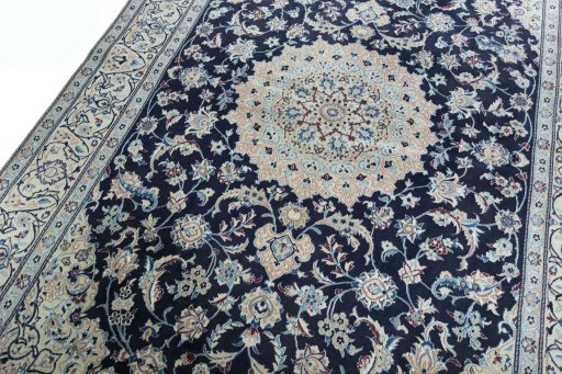 Backside of handmade New Nain rug showing knot structure and weave density