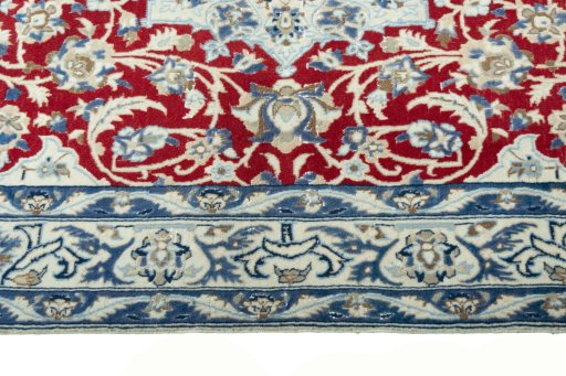 Corner detail of 2000s Nain rug showing border pattern and Wool pile