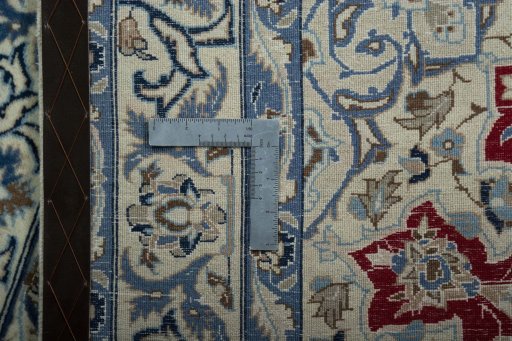 Backside of handmade 2000s Nain rug showing knot structure and weave density