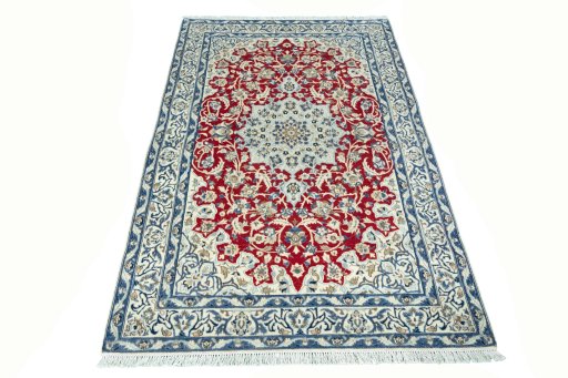 Surface texture of 2000s Nain rug with natural Wool and intricate pattern