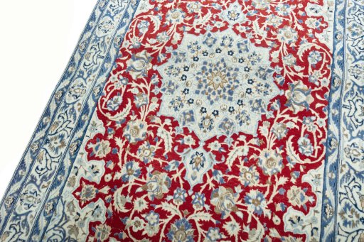 Backside of handmade 2000s Nain rug showing knot structure and weave density