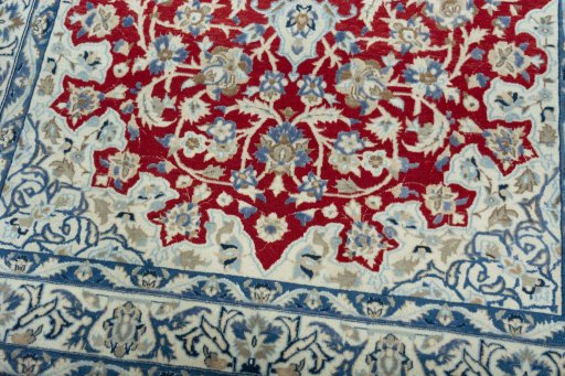 Close-up detail of 2000s Nain rug from Iran / Persia showing Wool weave