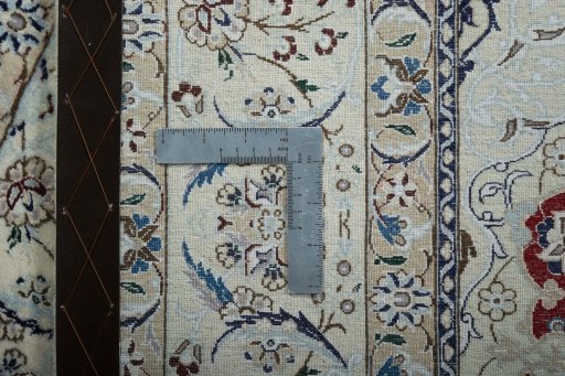 Backside of handmade New Nain rug showing knot structure and weave density