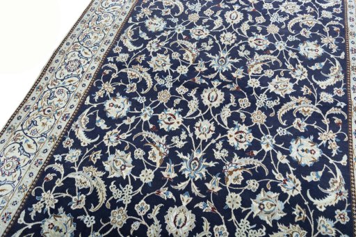 Backside of handmade New Nain rug showing knot structure and weave density