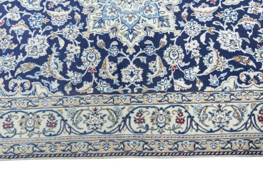 Corner detail of 2000s Nain rug showing border pattern and Wool pile