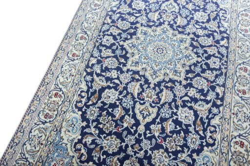 Backside of handmade 2000s Nain rug showing knot structure and weave density