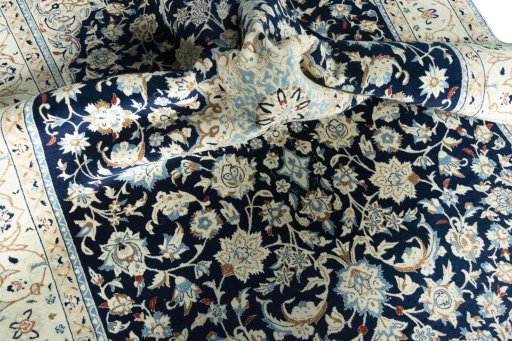 Surface texture of 2000s Nain rug with natural Wool and intricate pattern
