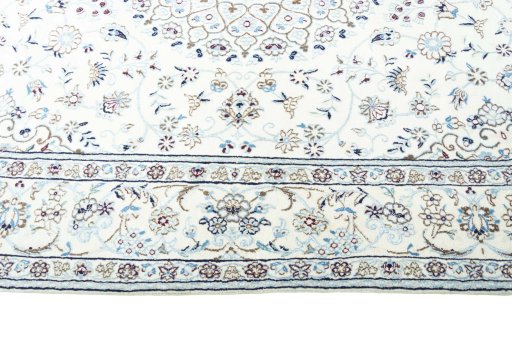 Corner detail of New Nain rug showing border pattern and Wool pile