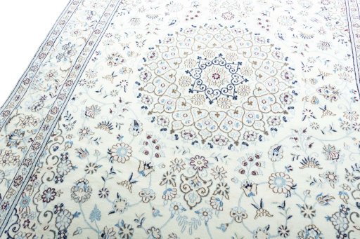 Backside of handmade New Nain rug showing knot structure and weave density