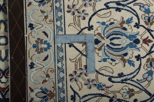 Backside of handmade New Nain rug showing knot structure and weave density