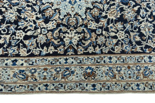 Corner detail of 2000s Nain rug showing border pattern and Wool pile