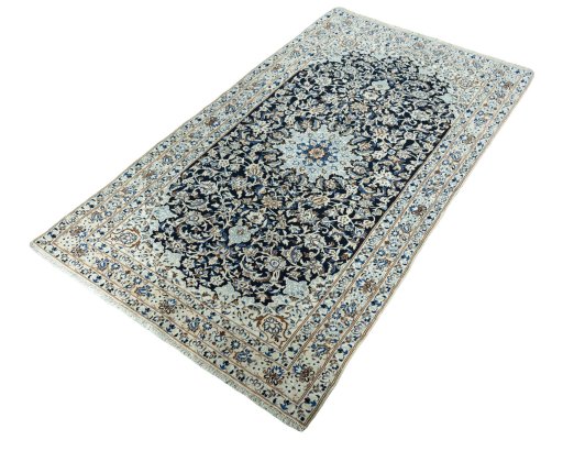 Corner detail of 2000s Nain rug showing border pattern and Wool pile