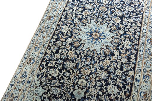 Backside of handmade 2000s Nain rug showing knot structure and weave density
