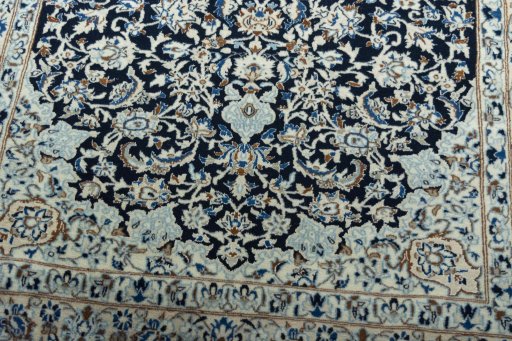 Close-up detail of 2000s Nain rug from Iran / Persia showing Wool weave