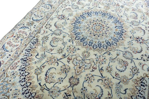 Backside of handmade New Nain rug showing knot structure and weave density