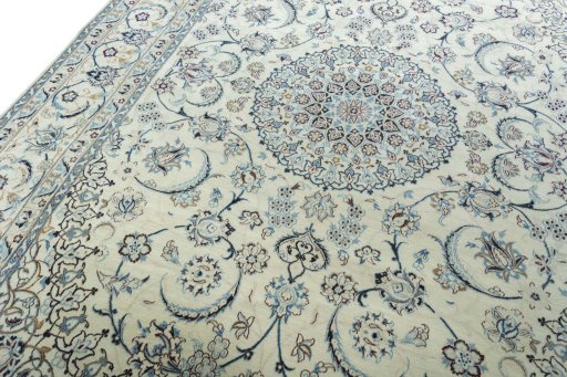 Backside of handmade New Nain rug showing knot structure and weave density
