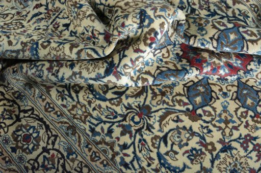 Surface texture of 2000s Nain rug with natural Wool and intricate pattern
