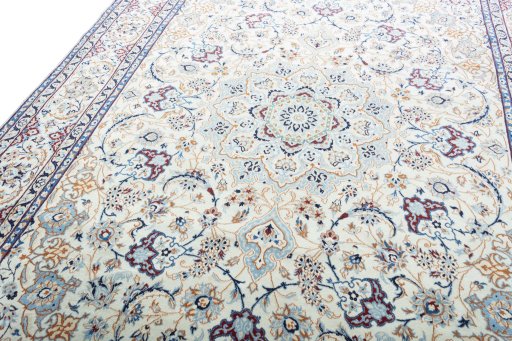 Backside of handmade New Nain rug showing knot structure and weave density
