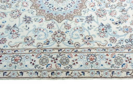 Corner detail of New Nain rug showing border pattern and Cork pile