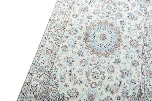 Backside of handmade New Nain rug showing knot structure and weave density