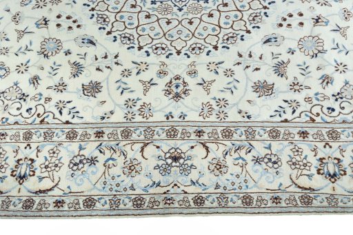 Corner detail of New Nain rug showing border pattern and Wool pile