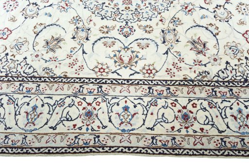 Corner detail of 2000s Nain rug showing border pattern and Wool pile