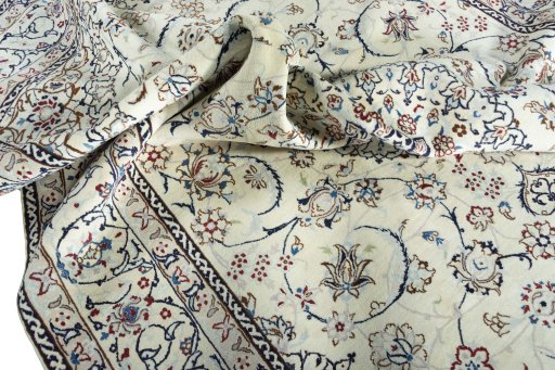 Surface texture of 2000s Nain rug with natural Wool and intricate pattern