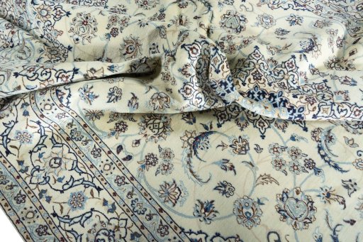 Surface texture of 2000s Nain rug with natural Wool and intricate pattern