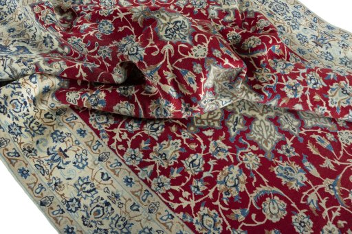 Surface texture of 2000s Nain rug with natural Wool and intricate pattern