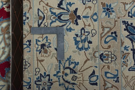 Backside of handmade 2000s Nain rug showing knot structure and weave density