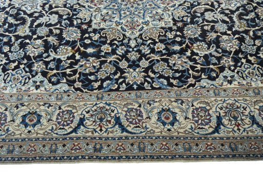 Corner detail of 2000s Nain rug showing border pattern and Wool pile