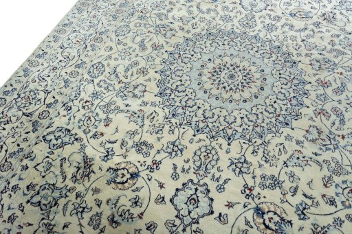Backside of handmade New Nain rug showing knot structure and weave density