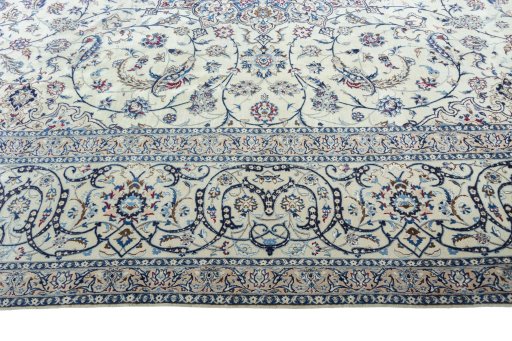 Corner detail of New Nain rug showing border pattern and Silk pile
