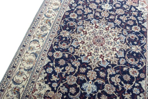Backside of handmade New Nain rug showing knot structure and weave density