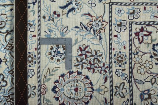Backside of handmade New Nain rug showing knot structure and weave density