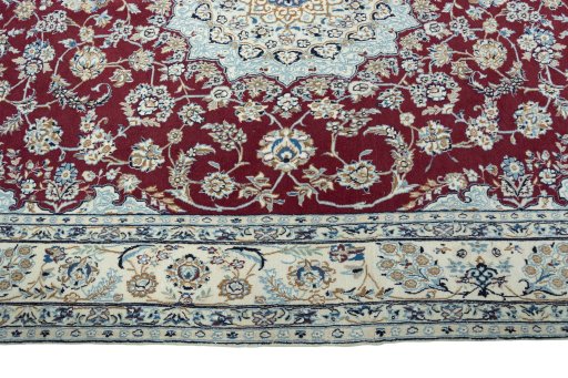 Corner detail of New Nain rug showing border pattern and Cork pile