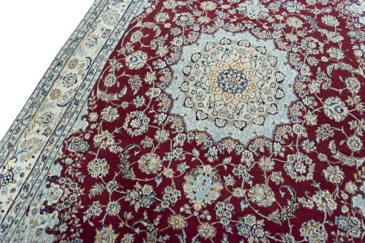 Backside of handmade New Nain rug showing knot structure and weave density