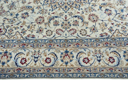 Corner detail of 2000s Nain rug showing border pattern and Wool pile