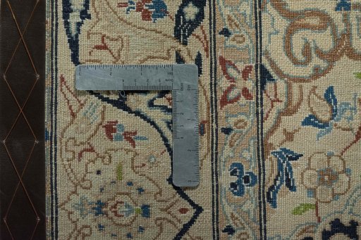 Backside of handmade 2000s Nain rug showing knot structure and weave density