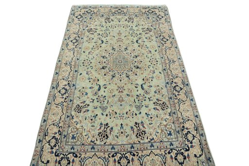 Surface texture of 2000s Nain rug with natural Wool and intricate pattern